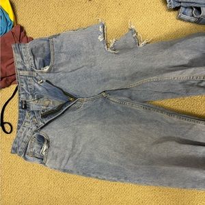 Prettylittlething jeans with rips on the side